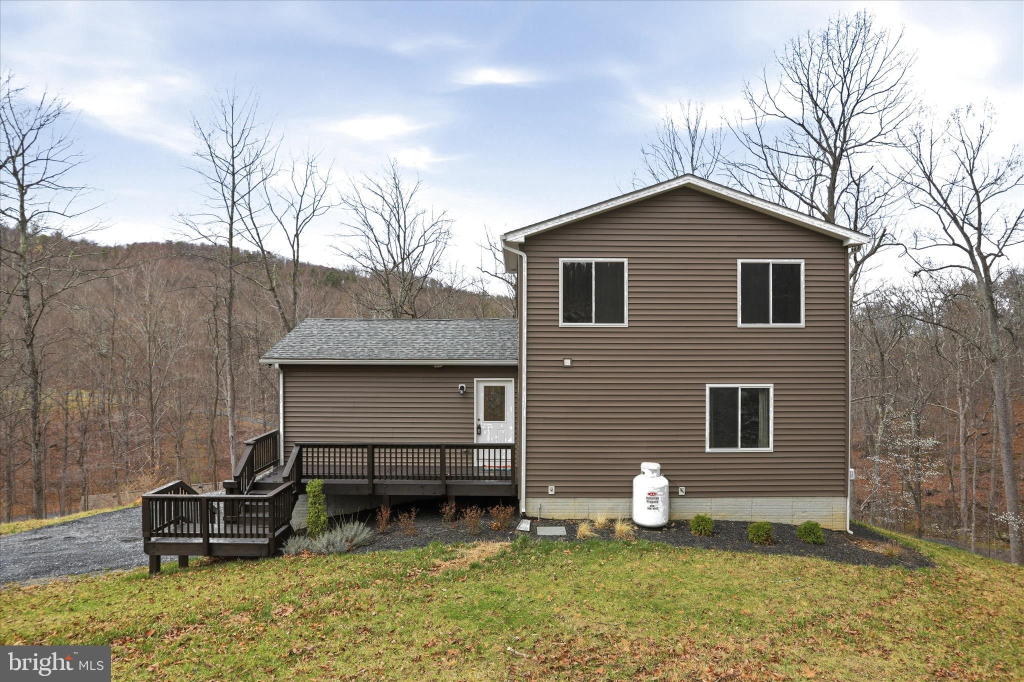 490 Black Twig Road Linden, VA 22642 - Photo 41 of 44 a house view with a sitting space and garden