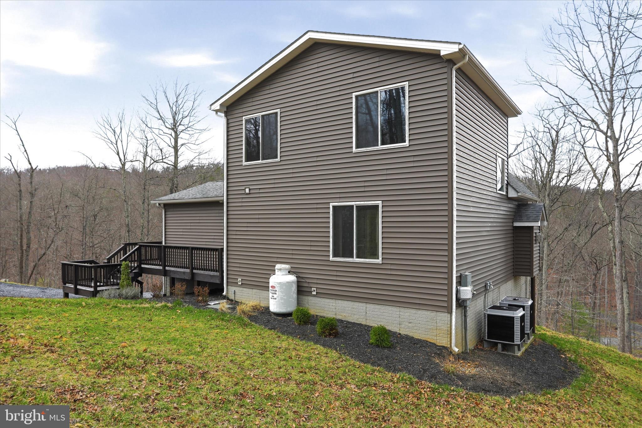 490 Black Twig Road Linden, VA 22642 - Photo 42 of 44 a front view of a house with garden