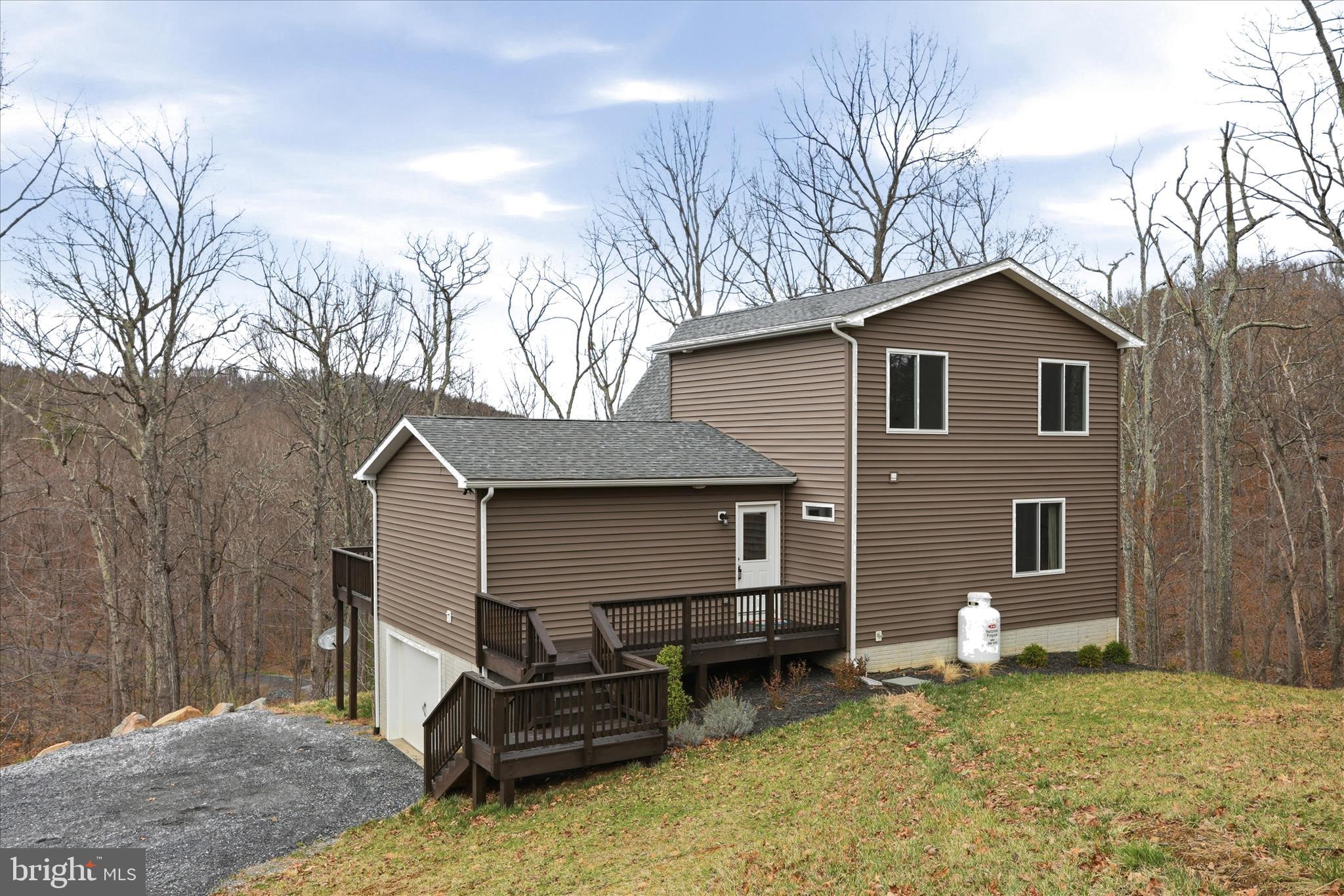490 Black Twig Road Linden, VA 22642 - Photo 43 of 44 a front view of a house with garden