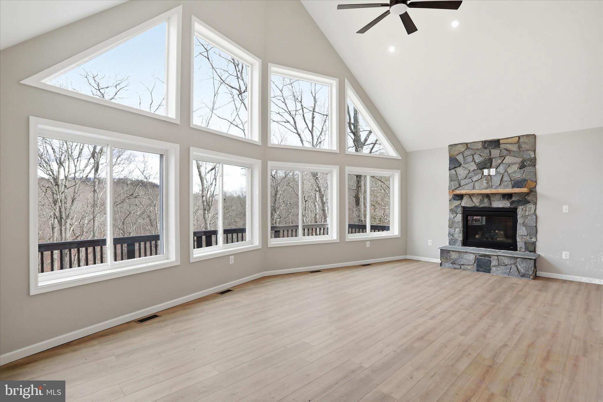 490 Black Twig Road Linden, VA 22642 - Photo 8 of 44 a view of an empty room with a window and a fireplace