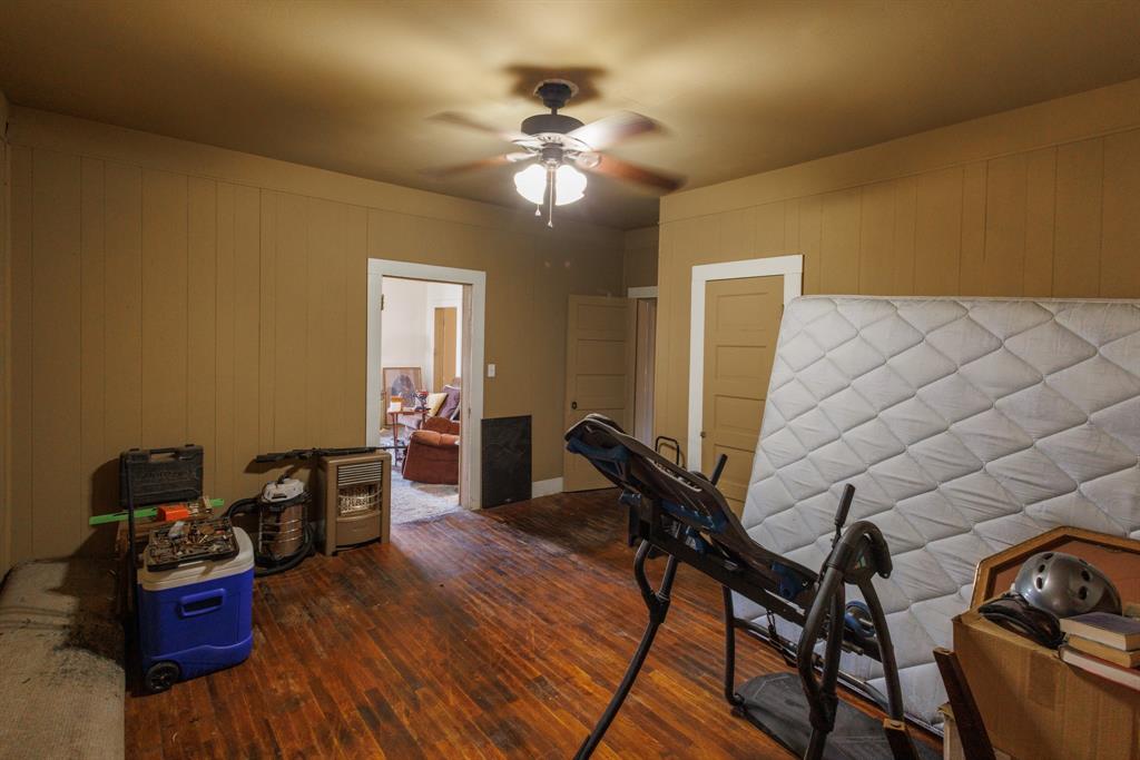 2202 Chester Street Sweetwater, TX 79556 - Photo 8 of 21 a living room with furniture and a chandelier