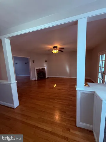 a view of a living room with hardwood floor