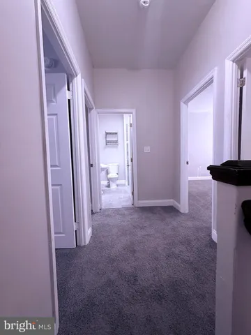 a view of a hallway with closet