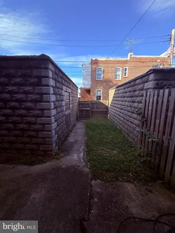 a view of house with backyard