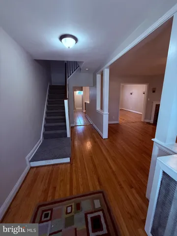 a view of entryway with wooden floor