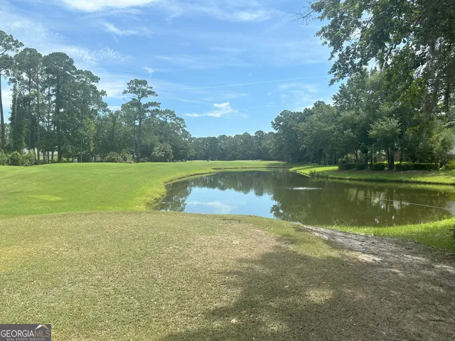 a view of a lake with a yard