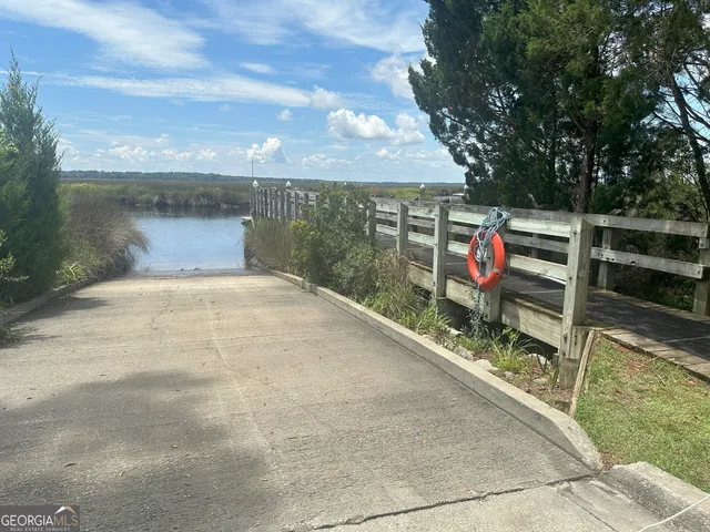 a view of a park with iron fence