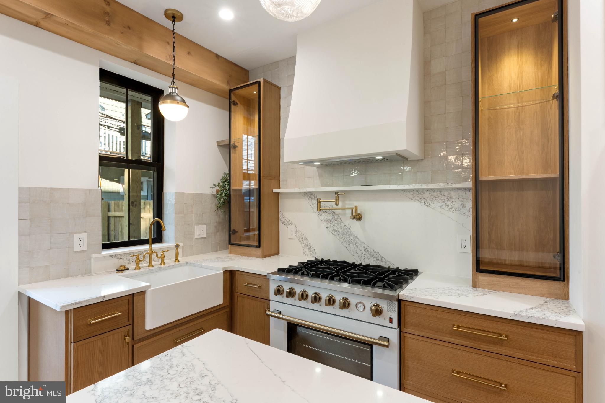 823 Mercer Street Philadelphia, PA 19125 - Photo 11 of 37 a kitchen with a stove and a sink