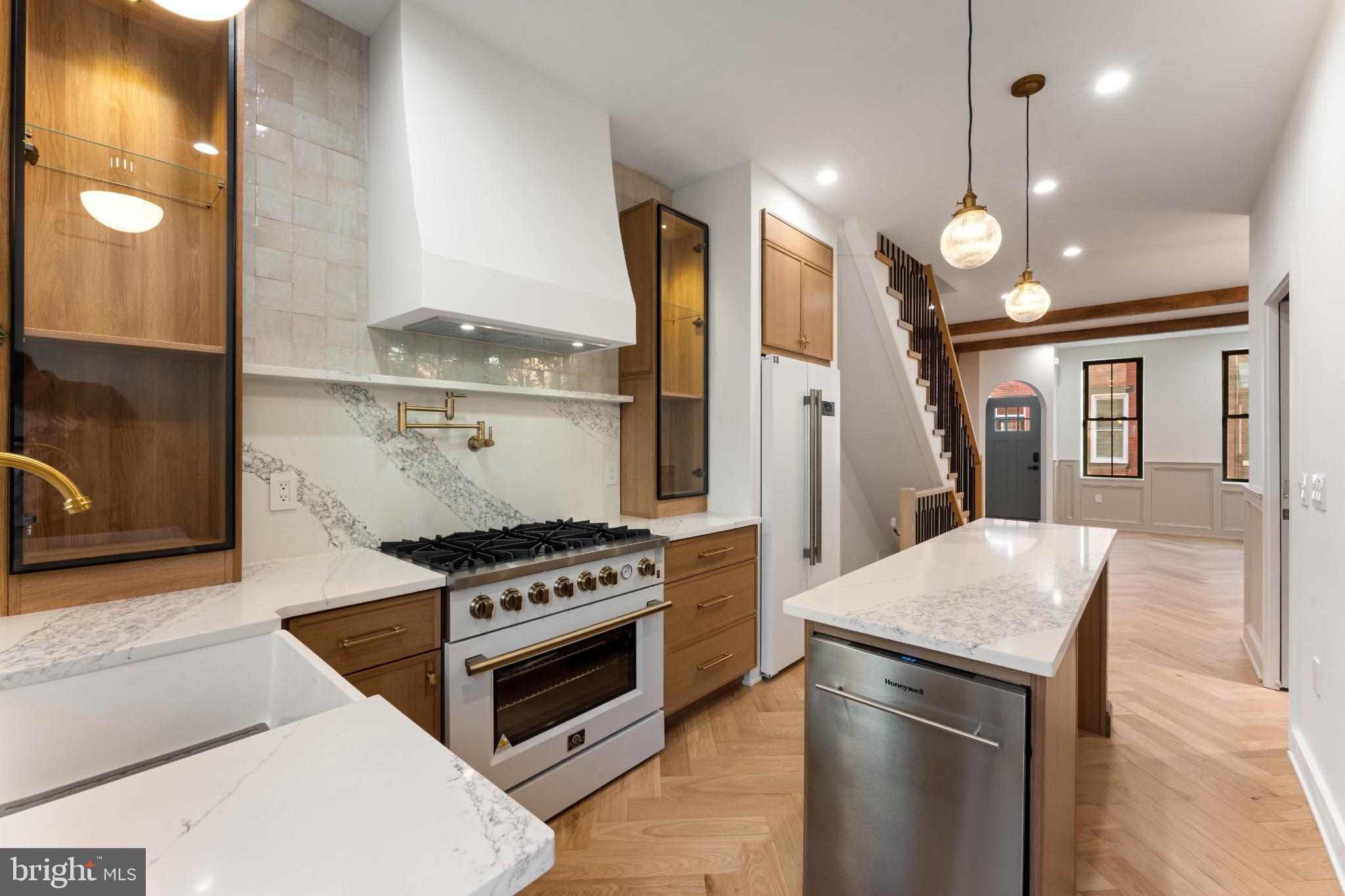 823 Mercer Street Philadelphia, PA 19125 - Photo 13 of 37 a kitchen with a stove and a refrigerator