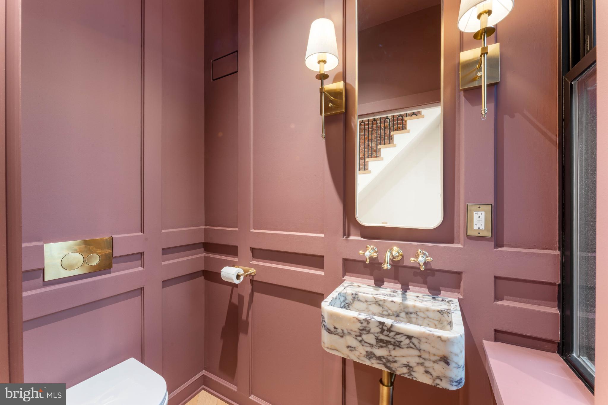 823 Mercer Street Philadelphia, PA 19125 - Photo 16 of 37 a bathroom with a sink mirror vanity and toilet