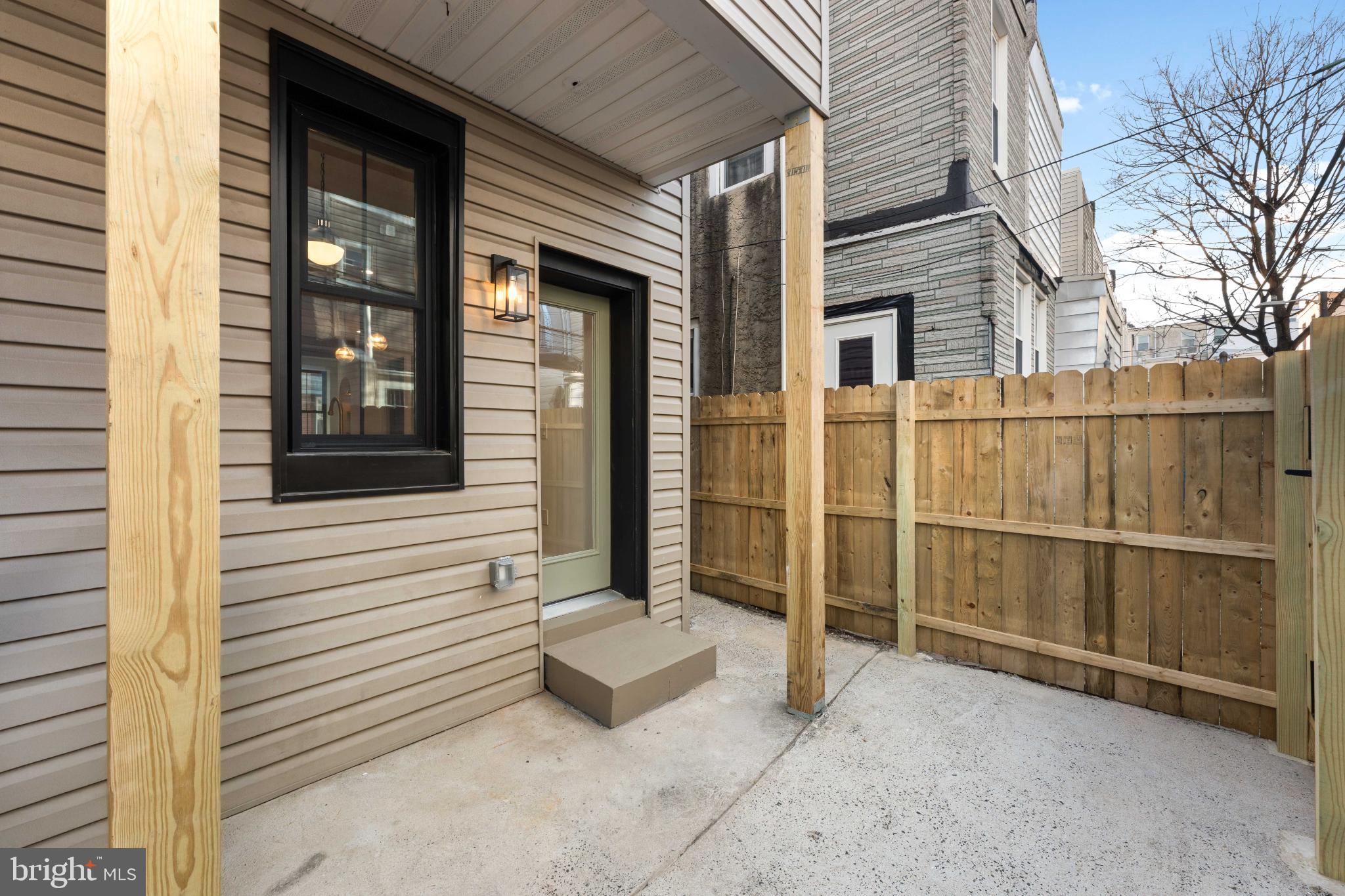 823 Mercer Street Philadelphia, PA 19125 - Photo 19 of 37 a view of a porch with a door and wooden walls