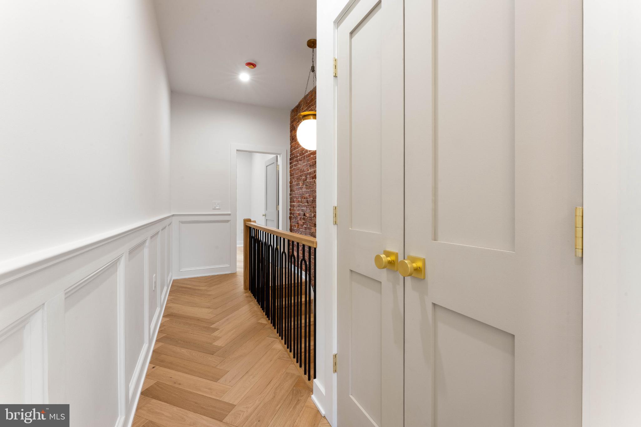 823 Mercer Street Philadelphia, PA 19125 - Photo 20 of 37 a view of a hallway with wooden cabinets