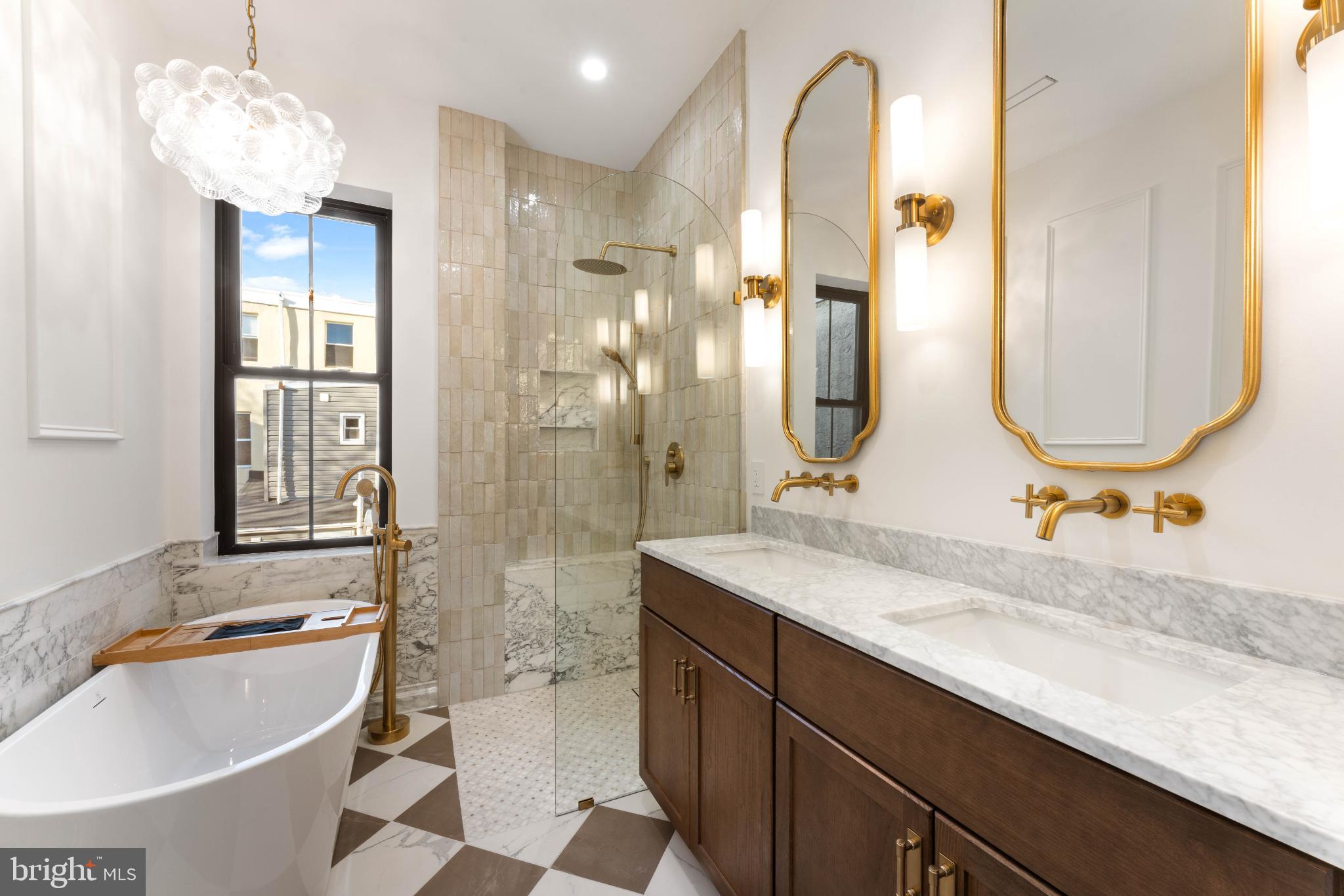 823 Mercer Street Philadelphia, PA 19125 - Photo 28 of 37 a bathroom with a tub sink and mirror