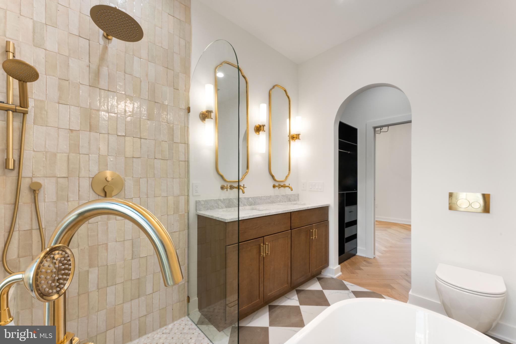 823 Mercer Street Philadelphia, PA 19125 - Photo 30 of 37 a bathroom with a sink a toilet a mirror and shower