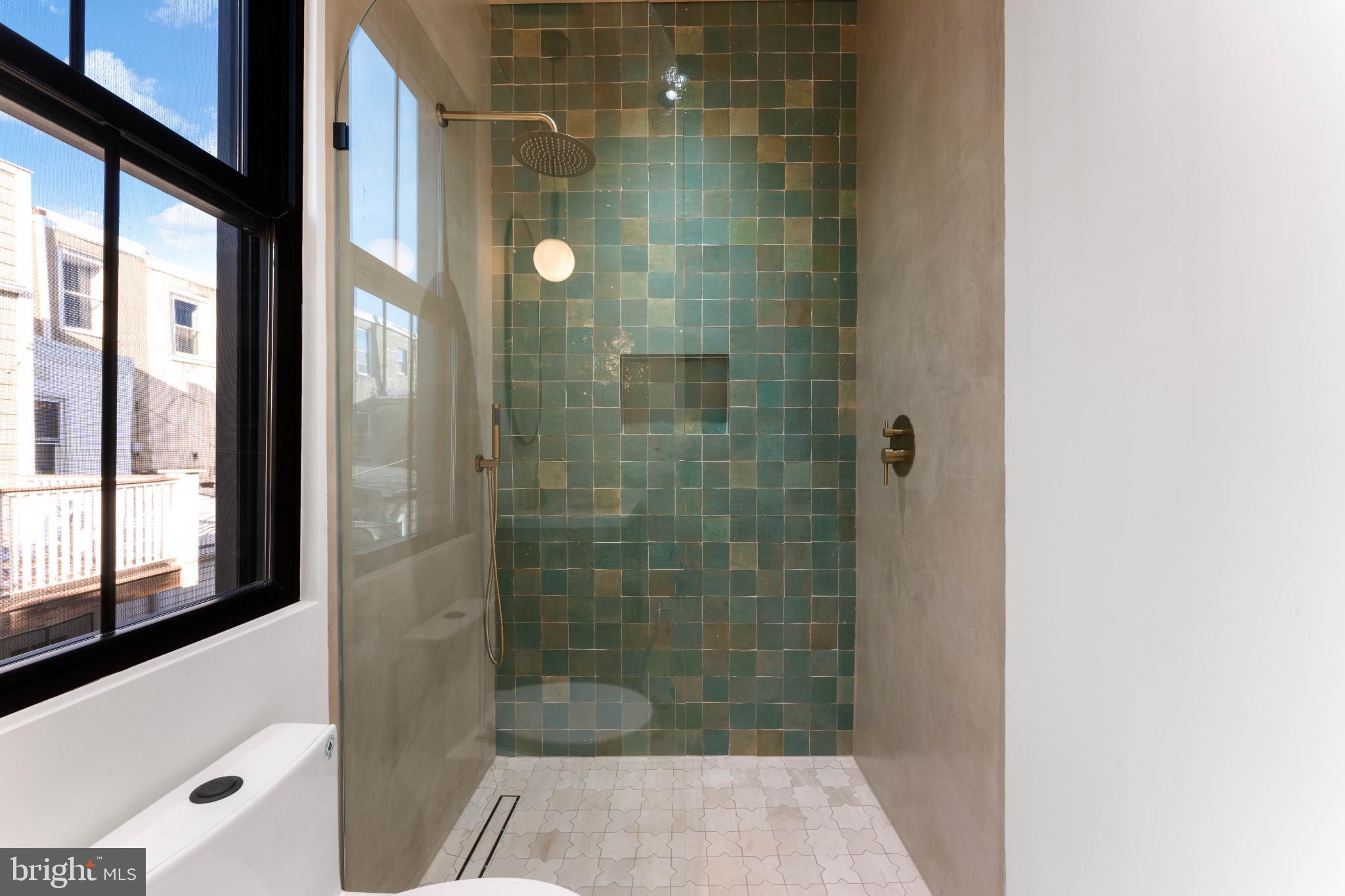 823 Mercer Street Philadelphia, PA 19125 - Photo 35 of 37 a bathroom with a shower and a sink