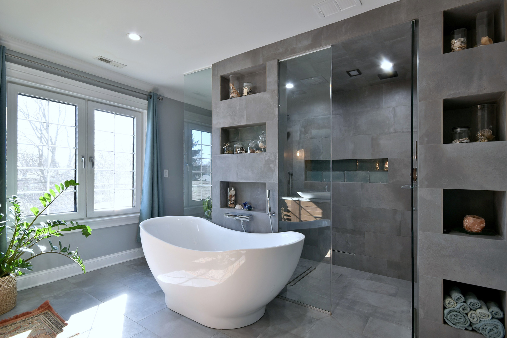 1237 Huber Lane Glenview, IL 60025 - Photo 17 of 49 a white bath tub sitting in a bathroom next to a window