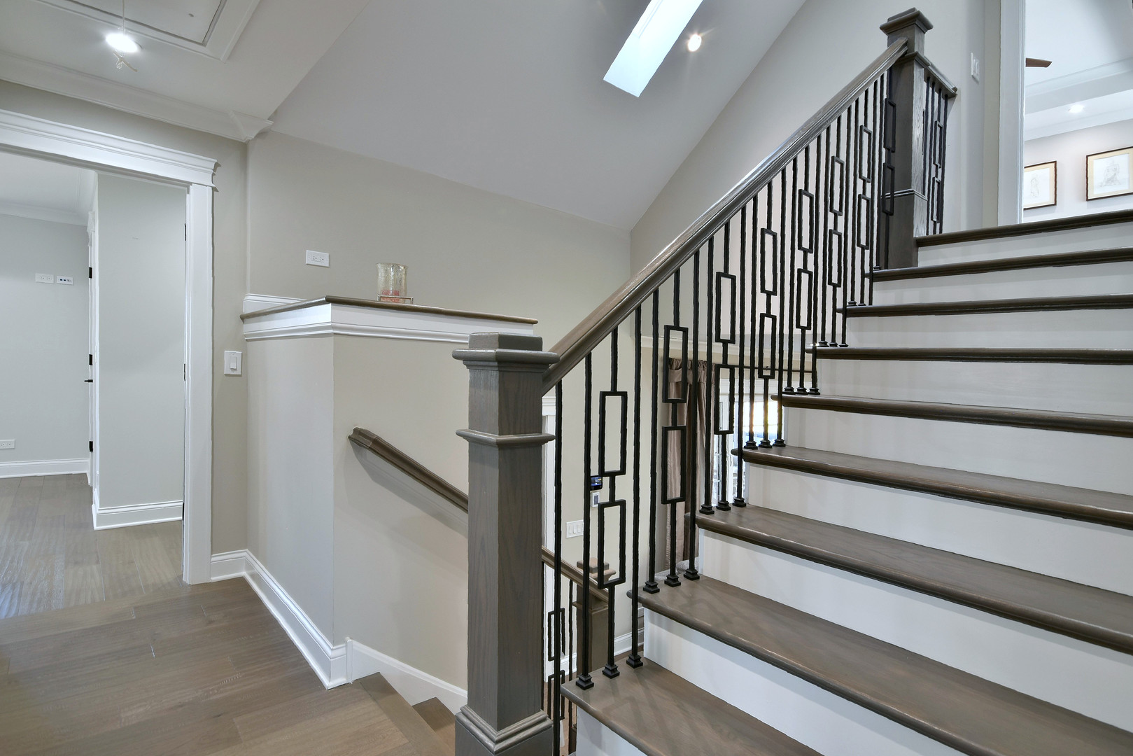 1237 Huber Lane Glenview, IL 60025 - Photo 37 of 49 a view of staircase with lots of frames on wall and a window