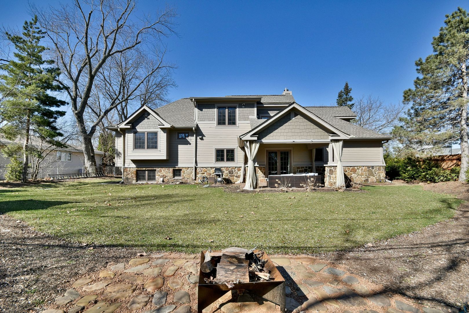 1237 Huber Lane Glenview, IL 60025 - Photo 46 of 49 a front view of a house with a garden