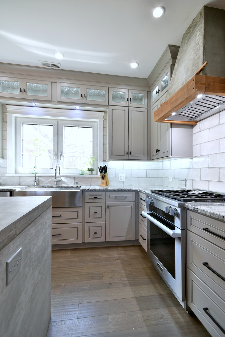 1237 Huber Lane Glenview, IL 60025 - Photo 7 of 49 a large kitchen with stainless steel appliances granite countertop a stove and a sink