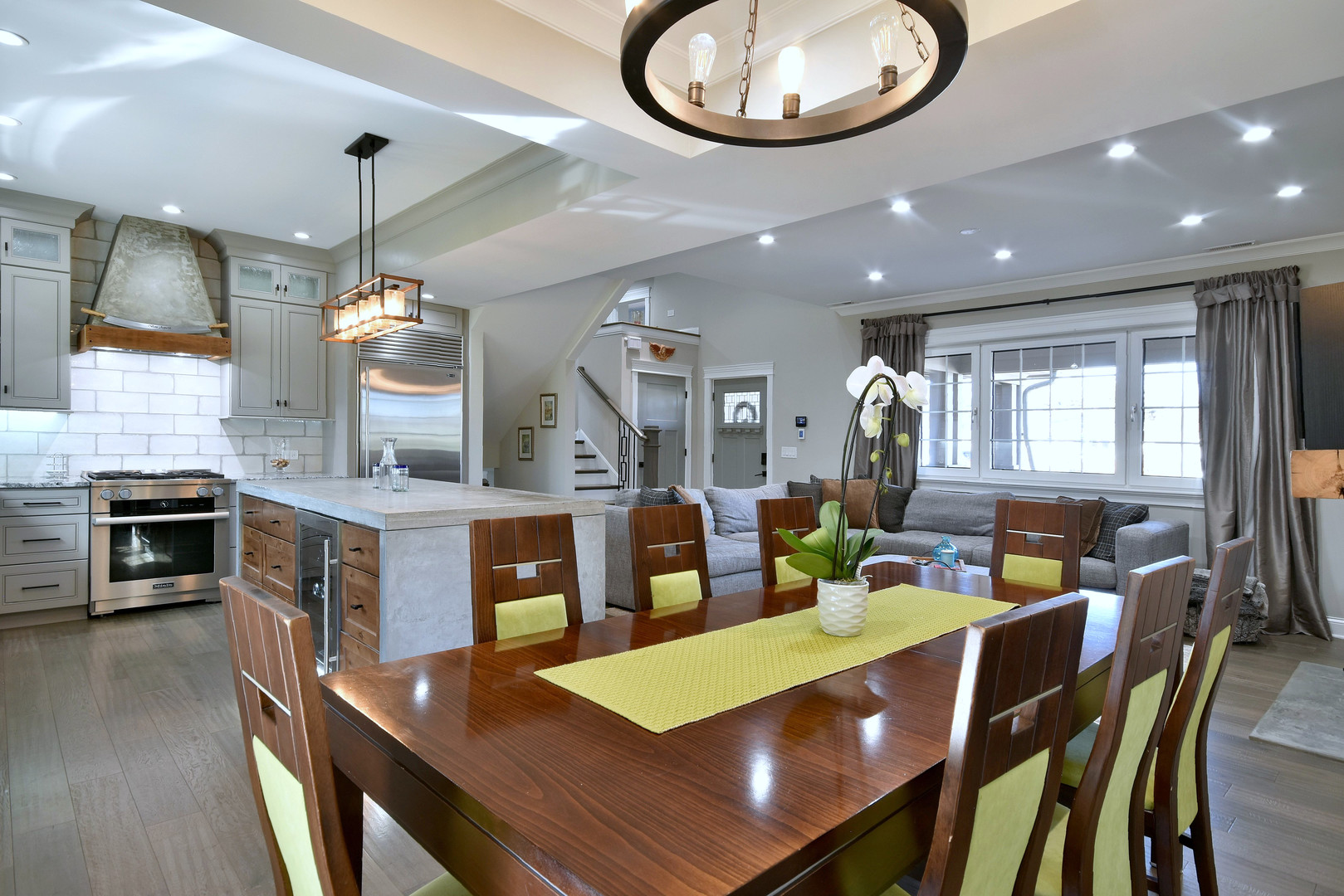 1237 Huber Lane Glenview, IL 60025 - Photo 10 of 49 a view of a dining room with furniture a kitchen and chandelier