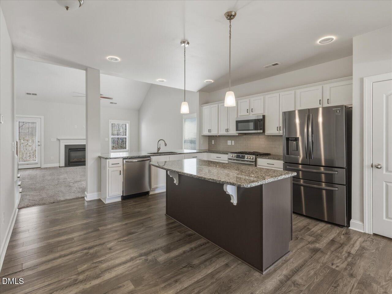 60 Pepper Lane Garner, NC 27529 - Photo 11 of 70 a kitchen with stainless steel appliances granite countertop a refrigerator a stove a sink and a oven