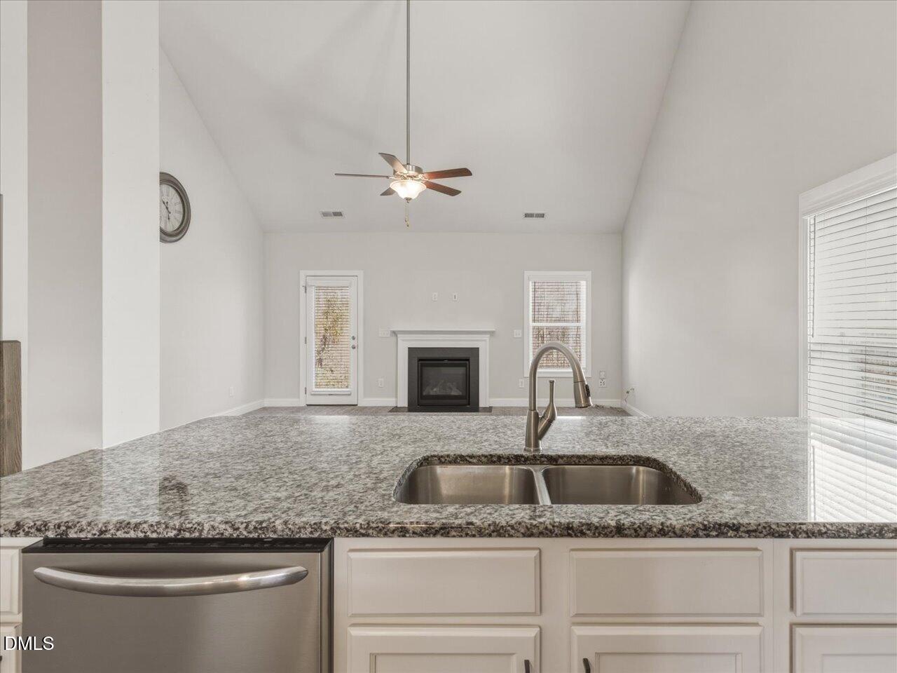 60 Pepper Lane Garner, NC 27529 - Photo 17 of 70 a kitchen with granite countertop a sink stainless steel appliances and chandelier
