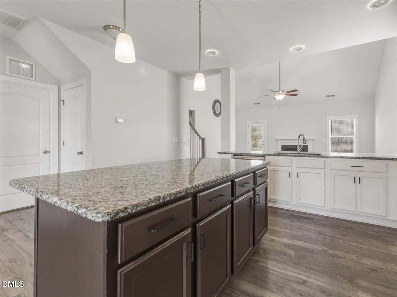60 Pepper Lane Garner, NC 27529 - Photo 20 of 70 a kitchen with a sink dishwasher and white cabinets with wooden floor
