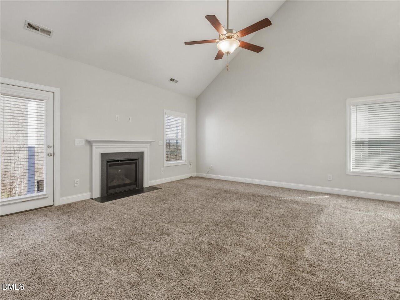 60 Pepper Lane Garner, NC 27529 - Photo 24 of 70 an empty room with windows and fireplace