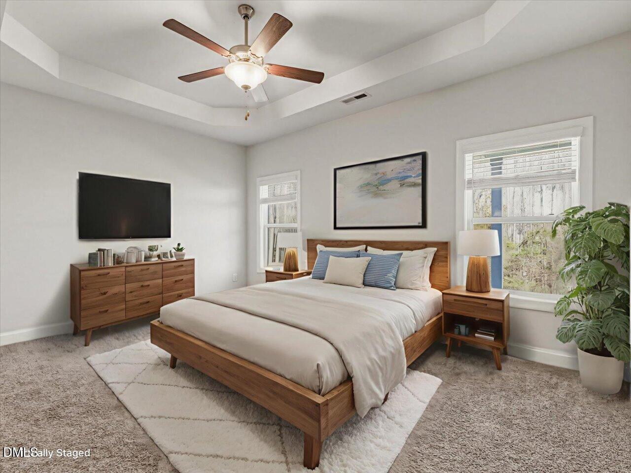60 Pepper Lane Garner, NC 27529 - Photo 31 of 70 a bedroom with a bed and a flat screen tv