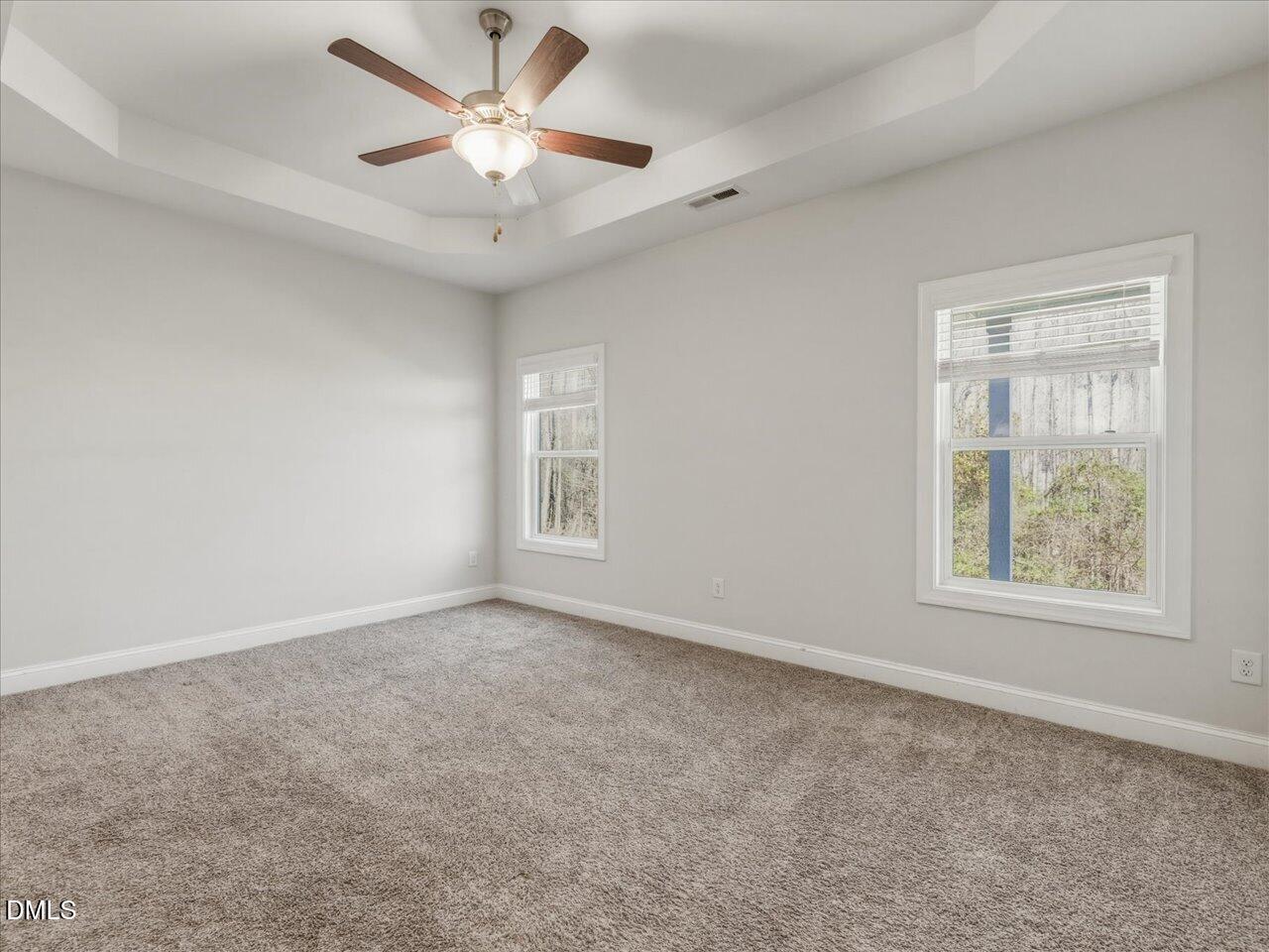 60 Pepper Lane Garner, NC 27529 - Photo 32 of 70 an empty room with windows and fan
