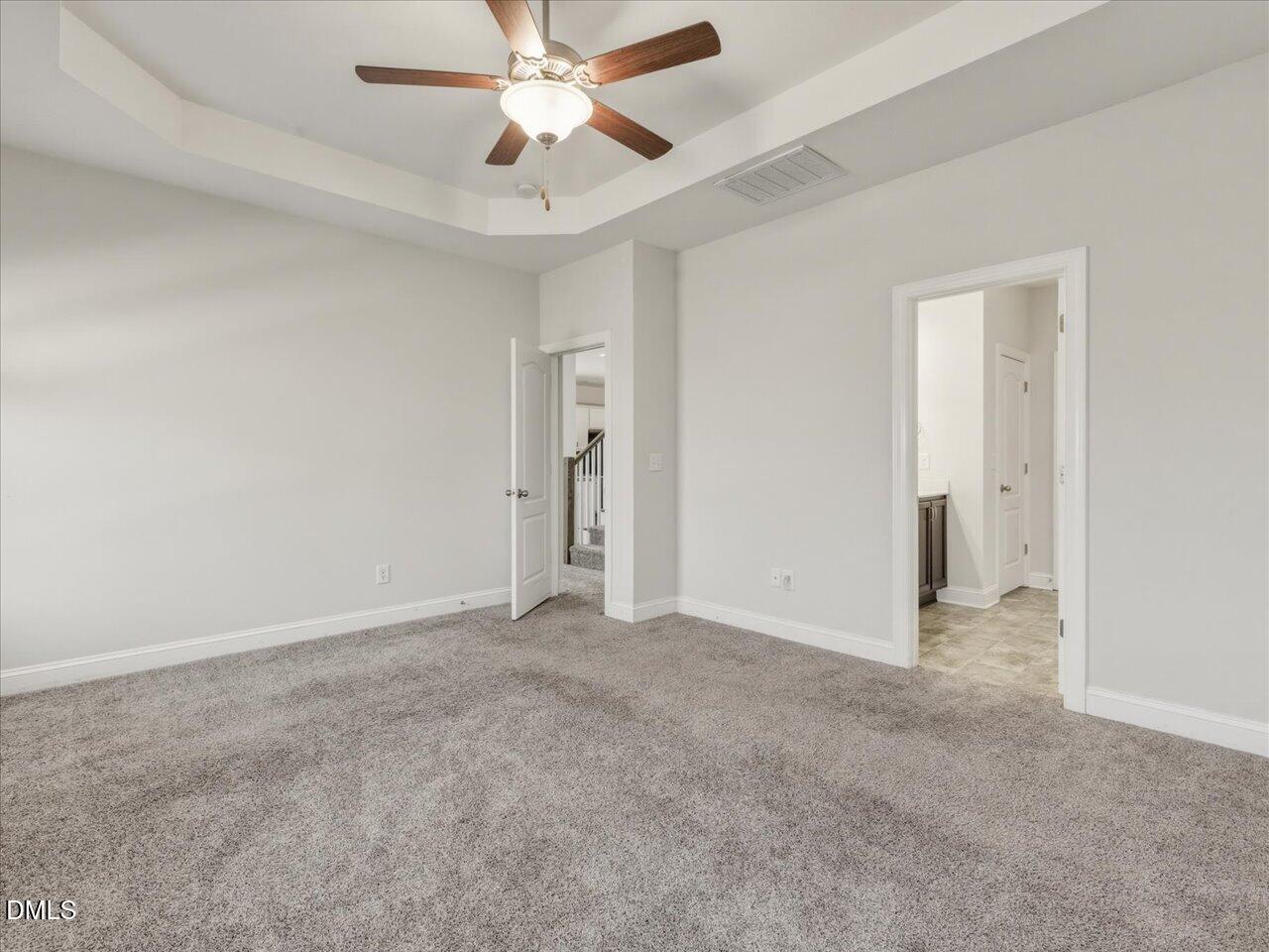 60 Pepper Lane Garner, NC 27529 - Photo 33 of 70 an empty room with closet and a chandelier fan