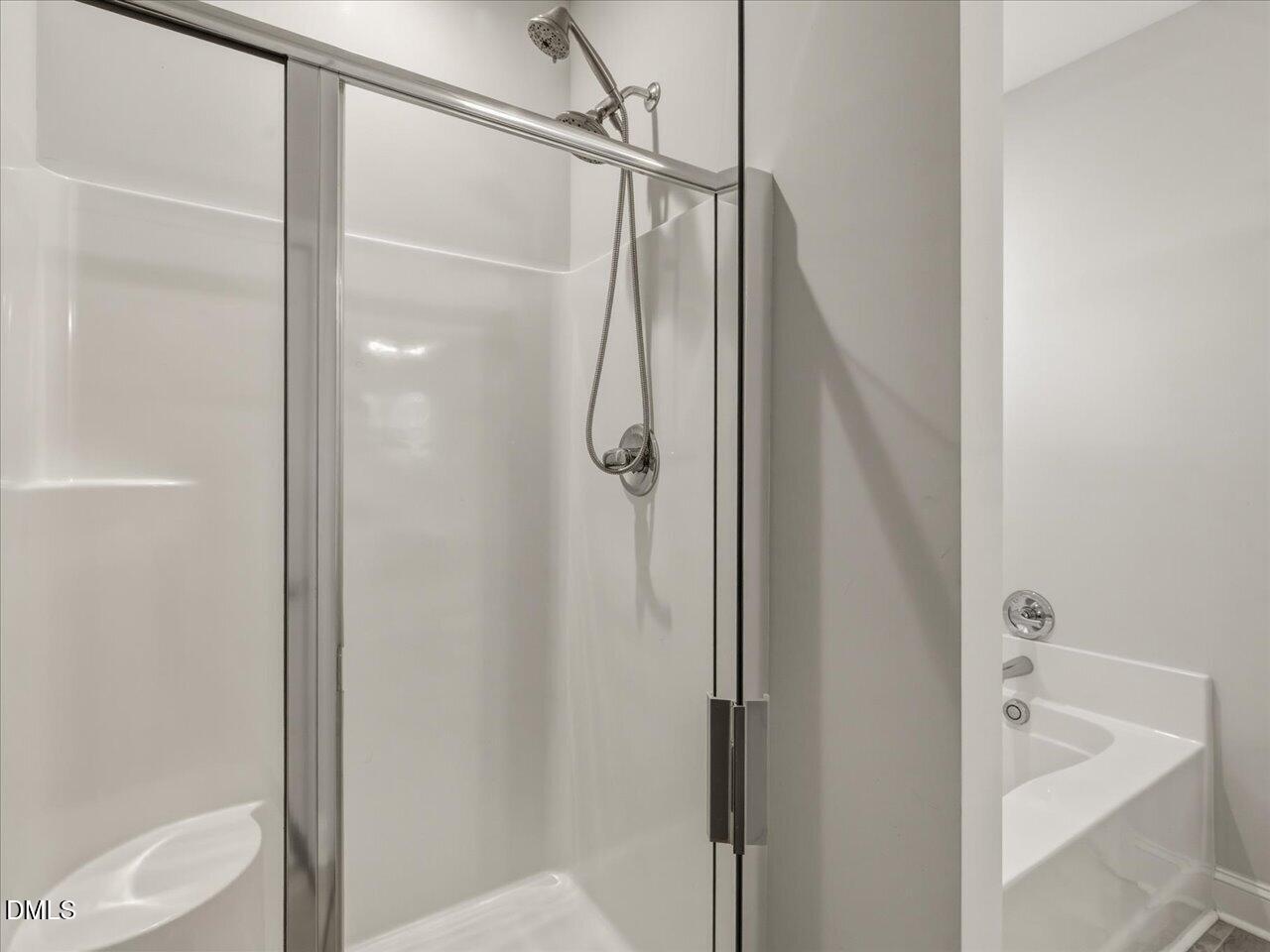 60 Pepper Lane Garner, NC 27529 - Photo 35 of 70 a bathroom with a shower and a tub