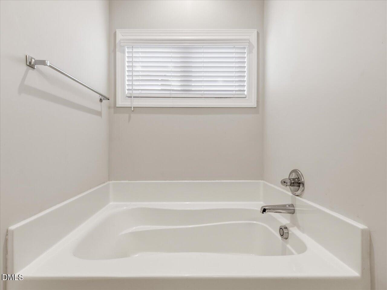 60 Pepper Lane Garner, NC 27529 - Photo 36 of 70 a white bath tub sitting next to a window