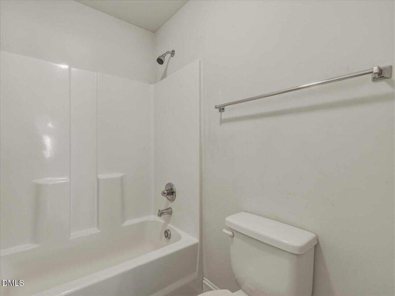 60 Pepper Lane Garner, NC 27529 - Photo 52 of 70 a bathroom with a bathtub and a toilet