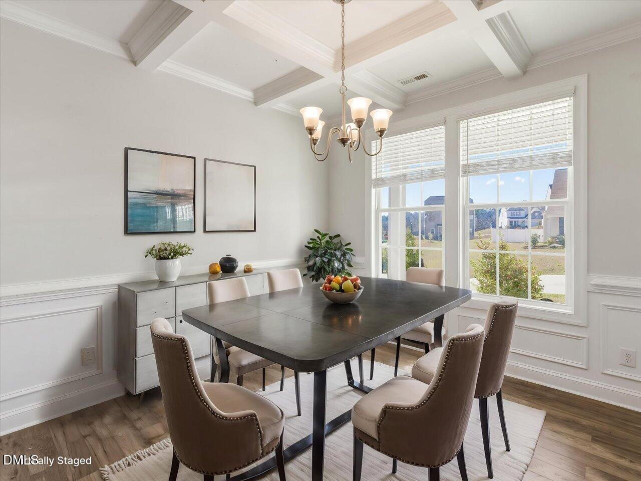 60 Pepper Lane Garner, NC 27529 - Photo 8 of 70 a view of a dining room with furniture a chandelier and wooden floor