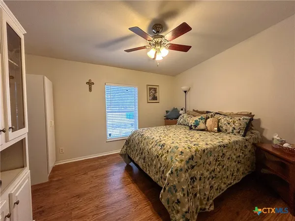 a bedroom with bed and window