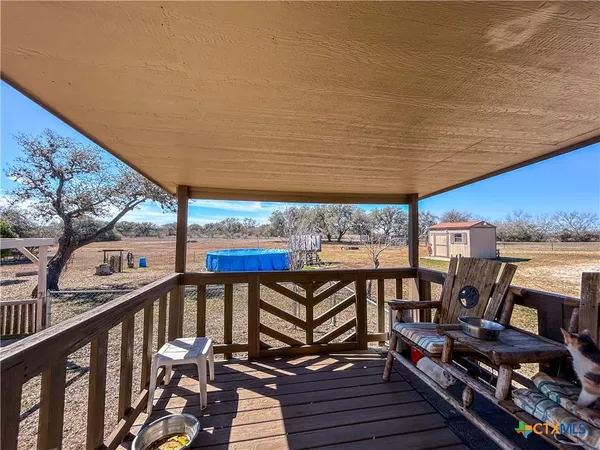 a view of a swimming pool with an outdoor seating