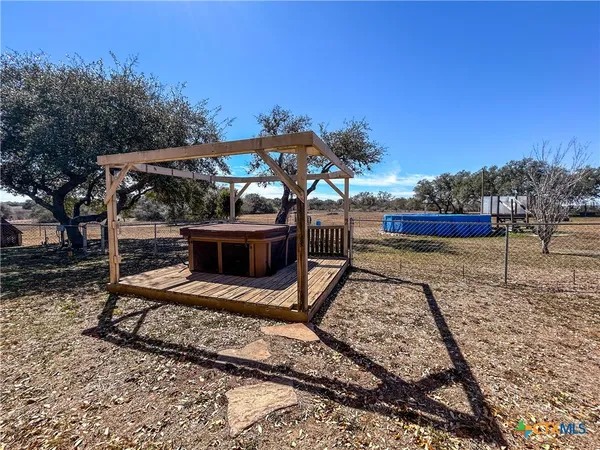 a view of a lake with palm trees