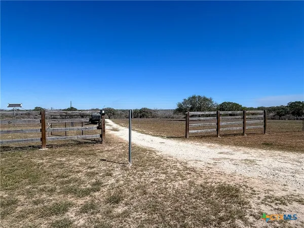 a view of a car park in front of house