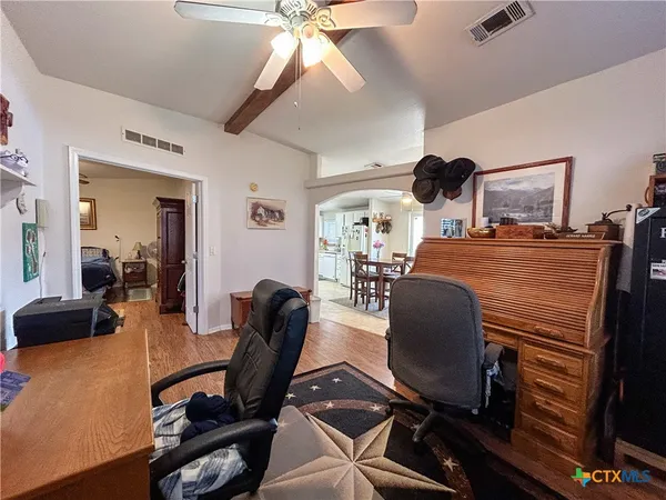 a bedroom with furniture and a window