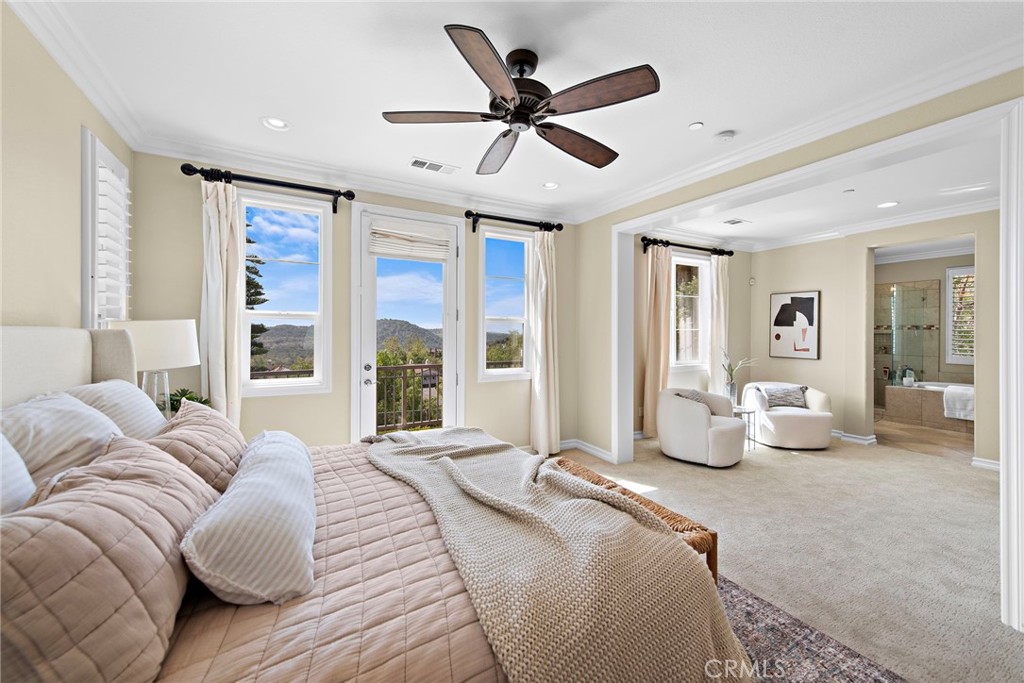 21 Via Cristobal San Clemente, CA 92673 - Photo 19 of 47 a spacious bedroom with a bed couch and a large window