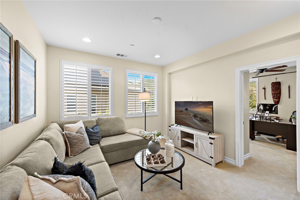 21 Via Cristobal San Clemente, CA 92673 - Photo 26 of 47 a living room with furniture a flat screen tv and a large window