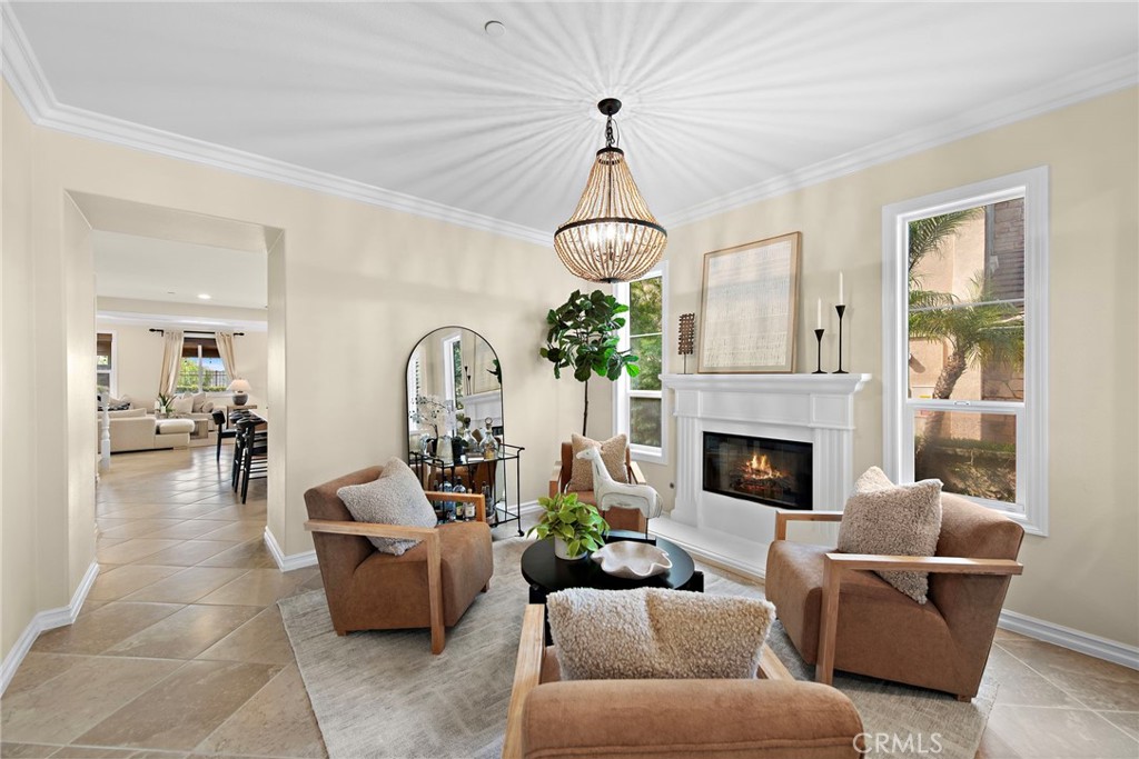 21 Via Cristobal San Clemente, CA 92673 - Photo 6 of 47 a living room with furniture a chandelier and a fireplace