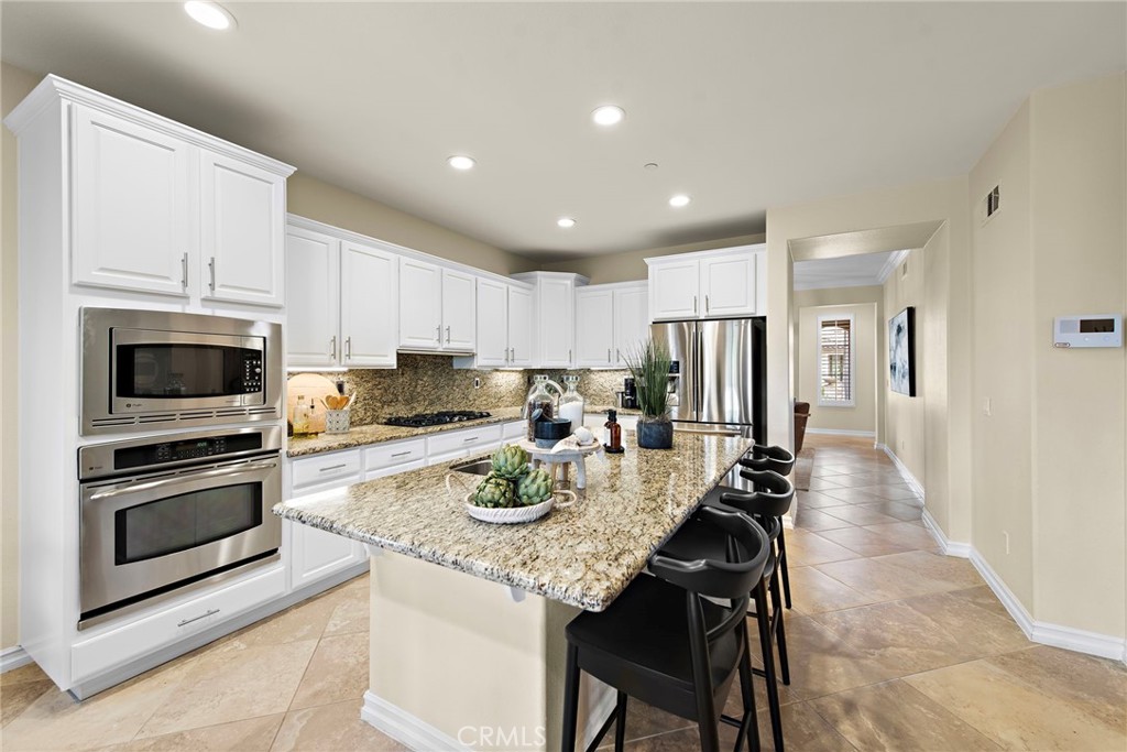 21 Via Cristobal San Clemente, CA 92673 - Photo 7 of 47 a kitchen with refrigerator cabinets and microwave