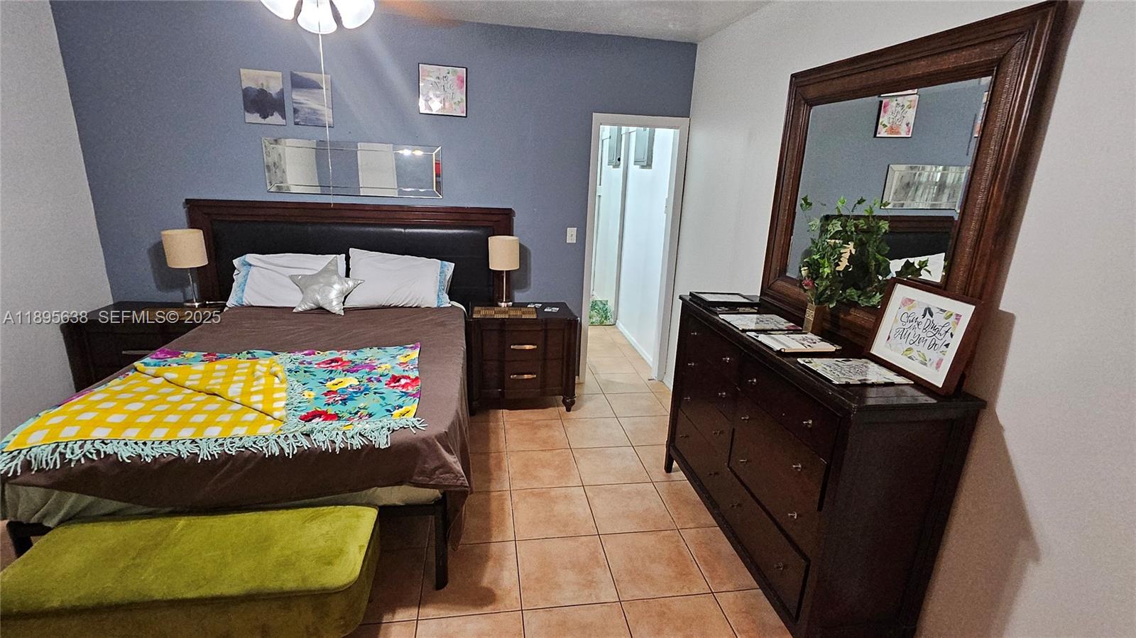 4201 Southwest 60th Place, Unit 2 South Miami, FL 33155 - Photo 11 of 14 a bed room with a bed and a television