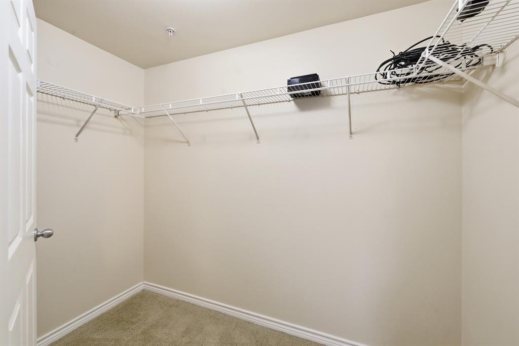 3102 Kings Road, Unit 2212 Dallas, TX 75219 - Photo 14 of 30 a view of a room with racks on the wall