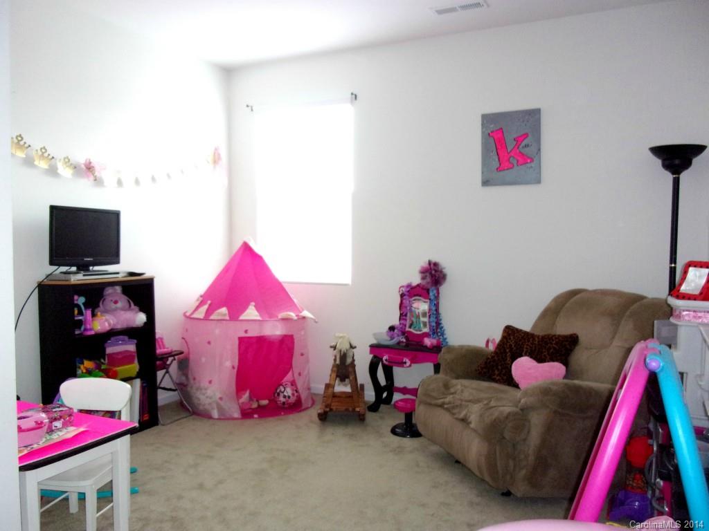1019 Green Terra Road Indian Trail, NC 28079 - Photo 13 of 20 a bedroom with a bed and a couch