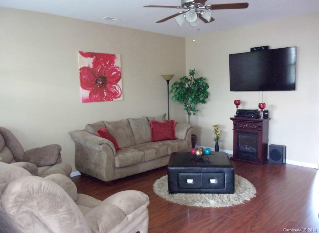 1019 Green Terra Road Indian Trail, NC 28079 - Photo 7 of 20 a living room with furniture and a flat screen tv