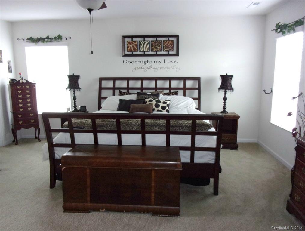 1019 Green Terra Road Indian Trail, NC 28079 - Photo 10 of 20 a bedroom with furniture and a bed