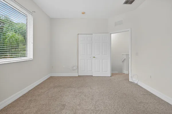 a view of an empty room with a window